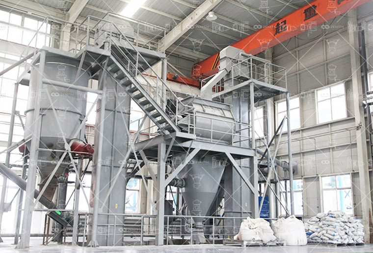 Raw lignite being fed into a Hammer Mill for initial coarse grinding into 0-3mm particles.